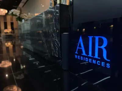a sign that reads airresumes in a window at Destina Stays @Air Residences Makati, MetroManila in Manila