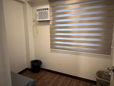 a room with a window with a air conditioner at Casa Chena in Manila