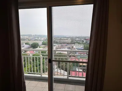 a view of a city from an open window at Casa Chena in Manila