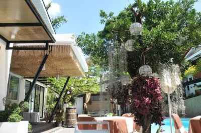 a patio with a fountain in front of a house at Date & Dine Resort in Antipolo
