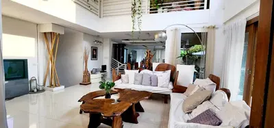 a living room with a couch and a table at Date & Dine Resort in Antipolo