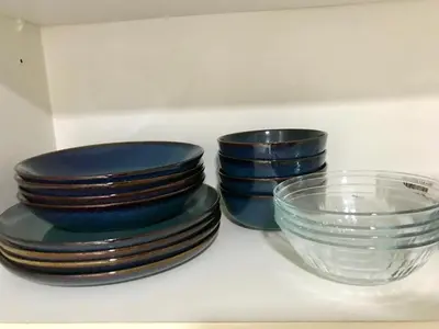 a group of blue plates and a glass bowl at New & Modern Cozy 1BR w/ Balcony@BGC, WiFi 300MBPS in Manila