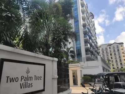 a sign for two palm tree villas in front of a building at Nadzcondotel-2 Two Palmtree villas nearby NAIA Terminal 3 in Manila