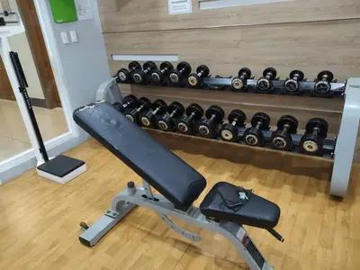 a gym with a rack of dumbbells at Nadzcondotel-2 Two Palmtree villas nearby NAIA Terminal 3 in Manila
