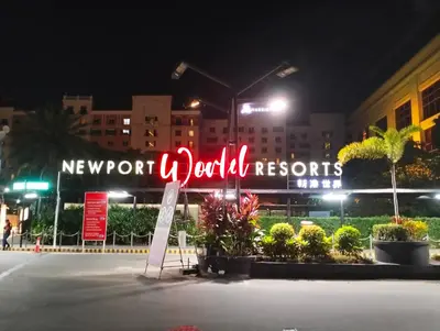 a sign for a newport jol aids resorts at night at Nadzcondotel-2 Two Palmtree villas nearby NAIA Terminal 3 in Manila