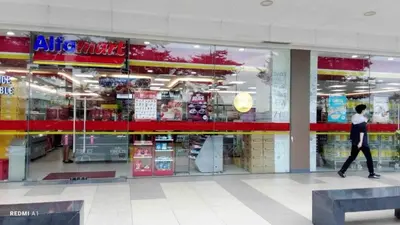 a person walking past a store window in a store at The SPLENDOR Comfortable living by Awsom Phil in Manila