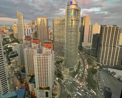 a view of a city with tall buildings and traffic at Destina Stays@ Air Residences Makati, Metro Manila in Manila