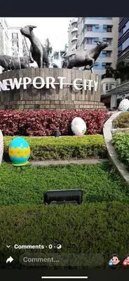 a sign for a newport city with a bird statue at Montecito HOME AWAY FROM HOME, across NAIA Terminal 3 in Manila