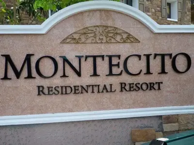 a sign for a monticello residential resort at Montecito HOME AWAY FROM HOME, across NAIA Terminal 3 in Manila
