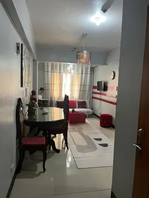 a living room with a table and a couch at Montecito HOME AWAY FROM HOME, across NAIA Terminal 3 in Manila
