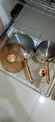 two pans sitting on top of a shelf in an oven at Skyia's Pod a Premier Suite at Shore 2 Residences in Manila