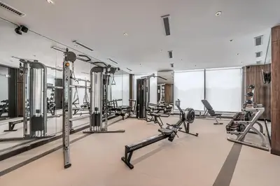 a gym with treadmills and cardio machines at Seda Nuvali Laguna near Tagaytay in Santa Rosa