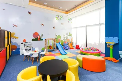 a childrens play room with a table and chairs at Seda Nuvali Laguna near Tagaytay in Santa Rosa