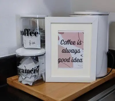 a white framed picture sitting on a wooden shelf at Casa Lim SMDC Light Residences Tower 3 in Manila