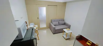a small living room with a chair and a television at Casa Lim SMDC Light Residences Tower 3 in Manila