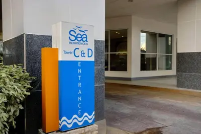 a sign in front of a building at Sea Residences - Classy Unit Near Mall of Asia, Arena, Ayala, Ikea, Okada, SMX, PITX, Airport in Manila