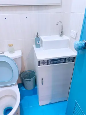a bathroom with a sink and a toilet at Blue Diamond Staycation beside Enchanted Kingdom in Santa Rosa Laguna in Santa Rosa