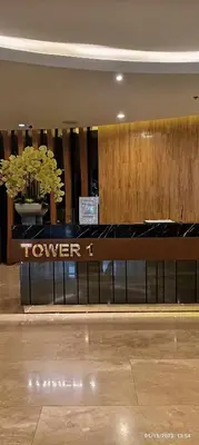a lobby with a bench in a building at Shore 2 Tower 1 JMB Staycation in Manila