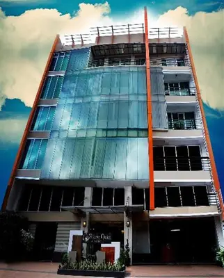 a tall building with a lot of windows at Silver Oaks Suites & Hotel in Manila