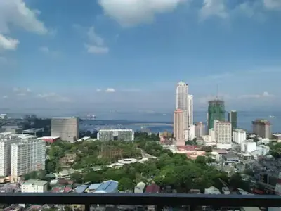 a view of a city skyline with buildings at The SCENIC: Comfortable living by Awsom Phil in Manila