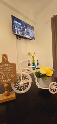 a room with a white bike with flowers on it at Newport's STAR at Montecito Residential Resort in Manila