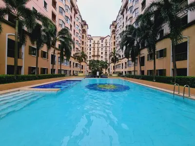 a large swimming pool in the middle of a building at Newport's STAR at Montecito Residential Resort in Manila