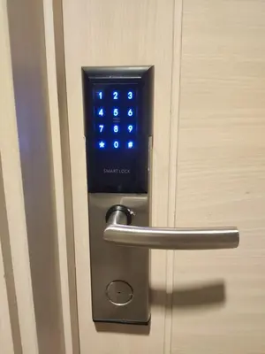 a close up of a door with a clock on it at Sea Residences 5mins walk to SM MoA, Arena, SMX, 55