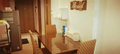 a dining room with a glass table and chairs at The ICONIC: Comfortable living by Awsom Phil in Manila