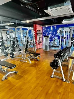 a gym with a bunch of equipment in a room at Luxury living @ Eastwood in Manila
