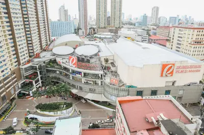 an overhead view of a city with tall buildings at Pacific Bay Grand Suites in Manila