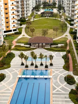 an overhead view of a swimming pool at a resort at Stunning 1-Bedroom Condo in Manila