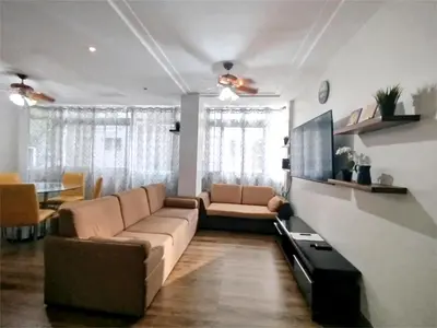 a living room with a couch and a table at SULIT CONDO Unit 2 Santa Mesa Manila in Manila
