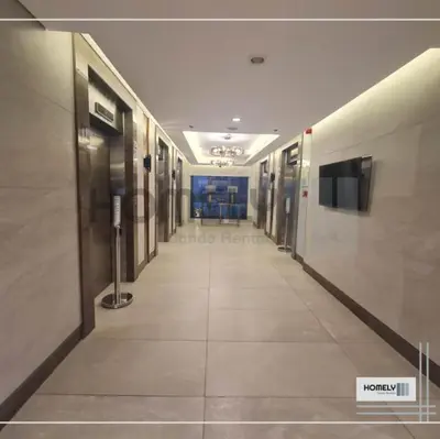 an empty hallway in a building with a tv on the wall at Homely - SMDC Green 2 Residences, Dasmarinas City in Pasong Bayog