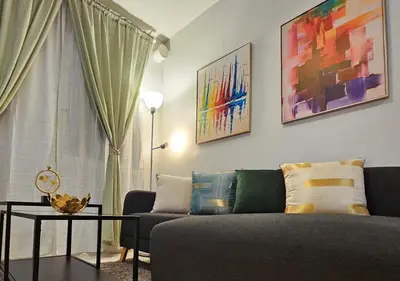 a living room with a couch and a table at Fabulous View Circulo Verde, Manila QC in Manila