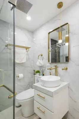 a bathroom with a sink and a toilet and a mirror at Modern Comfort Your Gateway to Quezon City One Free Parking in Manila
