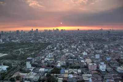 an aerial view of a city at sunset at The Milano Residences by Versace Stylish 1BR Condo in Manila