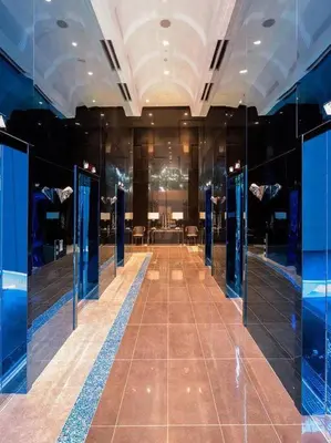 a dressing room with blue walls and a long hallway at The Milano Residences by Versace Stylish 1BR Condo in Manila
