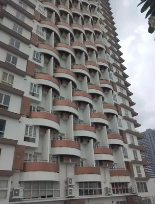 a tall building with red balconies on it at AMAZING VIEWS ACROSS SHANGRILA MALL and NEAR MEGAMALL GREENFIELD DISTRICT in Manila
