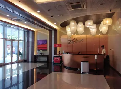 a person standing at a counter in a store at AMAZING VIEWS ACROSS SHANGRILA MALL and NEAR MEGAMALL GREENFIELD DISTRICT in Manila
