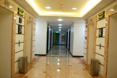 a corridor in a building with a hallway at Regency Grand Suites in Manila