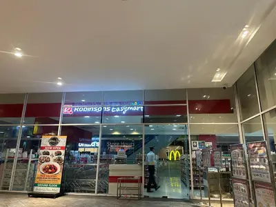a store front of a store with a man in the window at Clazzy Home At San Lorenzo in Manila