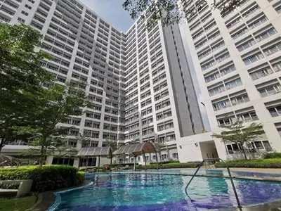 a swimming pool in front of a large building at Sunshine at Grace nr BGC in Manila