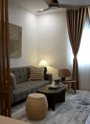 a living room with a couch and a table at NUVALI Amaia Steps Parkway 2 BR Condo THE SANCTUARY with pool, free parking near Carmelray Industrial Park, Ayala Solenad, Xavier School in Pitland