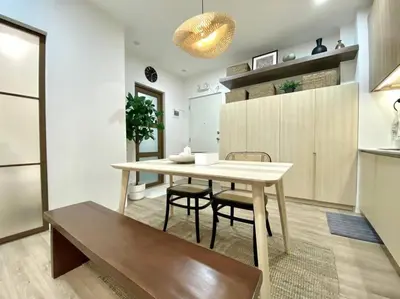 a kitchen with a table and chairs in a room at NUVALI Amaia Steps Parkway 2 BR Condo THE SANCTUARY with pool, free parking near Carmelray Industrial Park, Ayala Solenad, Xavier School in Pitland