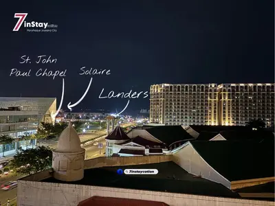 a view of a city at night with buildings at 1BR Solemare Aseana MOA Okada Ayala Bay Mall COD Paranaque w/WIFI in Manila
