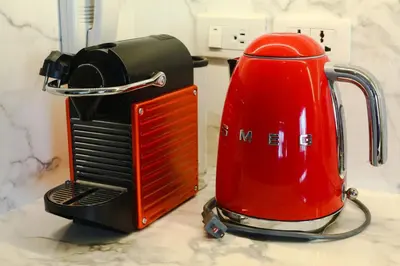 a red toaster sitting on top of a counter at Poblacion Penthouse Suite with Private Roofdeck in Manila