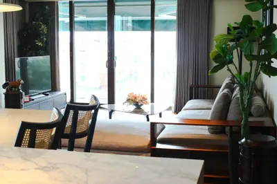 a living room with a couch and a table at Poblacion Penthouse Suite with Private Roofdeck in Manila