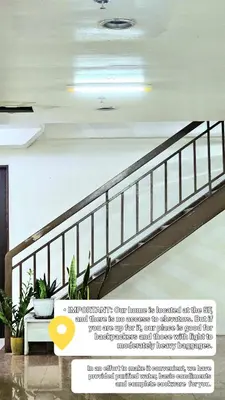 a staircase in a building with plants on it at THE FIKA ROOM near MNL Airport - Scandi Studio Unit with Fast Wi-Fi & Netflix - Read Full Property Desc before booking in Manila