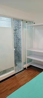 a room with a large glass door and a window at KS RESIDENCES in Manila