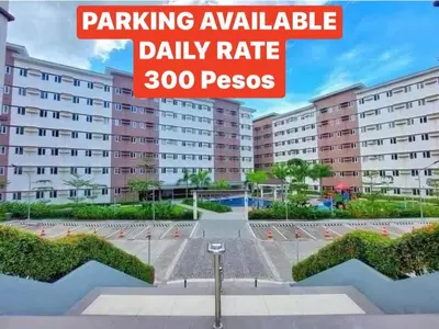 a sign that reads parking available daily rate psres at Cozy Belle Suite Relaxing Place at SMDC Hope Residences in Trece Martires
